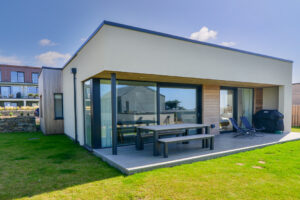 Exterior of The Look Out from the back of the house with patio leading from the master superking bedroom and the lounge area