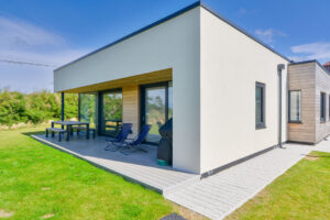Exterior of The Look Out from the back of the house with patio from the master superking bedroom and the lounge area