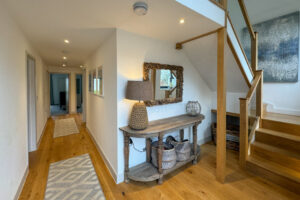 Entrance hall and staircase leading to the first floor at Morwynsow