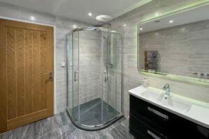 Shower cubicle and wash basin in ground floor bathroom at Morwynsow