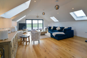 First floor lounge with corner sofa at Morwynsow