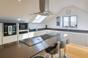 Large kitchen on the first floor with integrated hob and ovens at Morwynsow