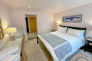 The ground floor king bedroom at Tremblaze with door into the lobby