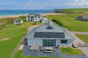 Aerial view from the rear of Tremblaze with the rear patio in the foreground and the beach and ocean in the back ground