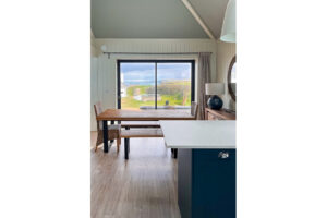 The double doors from the dining area to the small front patio at Tremblaze