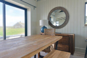 The dining table at Tremblaze with double doors onto the small front patio area
