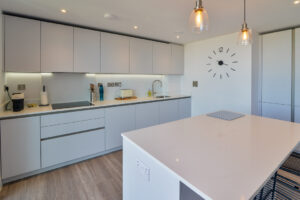 The kitchen area at The View with integrated hob, sink and small appliances