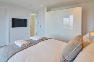 The second floor master ensuite king bedroom at The View with wall mounted tv