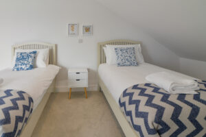 The second floor twin bedroom and bedside table at The View