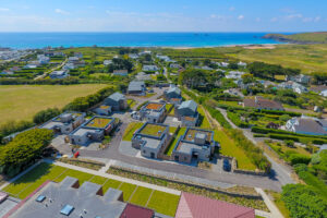 Aerial view from The View towards the beach, ocean, golf course and Trevose Head