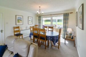 Dining area at Zefyros with doors to the conservatory