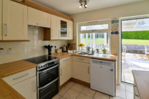 Kitchen at Zefyros with door to conservatory
