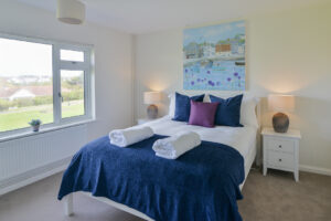 King bedroom with window to front of the house