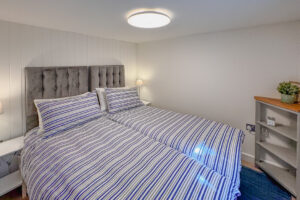 Twin single beds in bedroom 3 at No 8 Sandhills which can be made as a king bed if requested. The beds are small singles