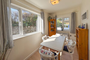 Dining area at No 8 Sandhills with table and chairs