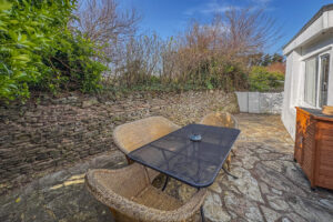 Rear paved area at No 8 Sandhills with outside table and chairs