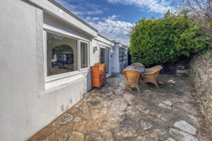 Rear paved area with outside furniture at No 8 Sandhills