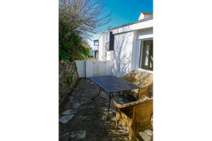 Rear paved area with outside furniture at No 8 Sandhills
