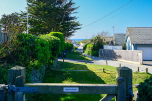 Picture of the beach road towards the beach from the pathway at No 8 Sandhills