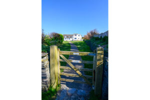 Picture of the gateway from the road to the communal grassed area at No 8 Sandhills