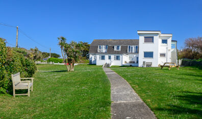 Picture from the gateway to the front of the apartments at No 8 Sandhills overlooking the communal grassed area.