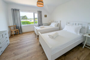 First floor twin bedroom with window to the front of the house at Whitehaven