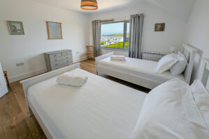 First floor twin room at Whitehaven with window to the front of the house