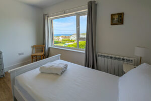 One of the singe beds in the first floor twin room at Whitehaven with views towards Trevose Head