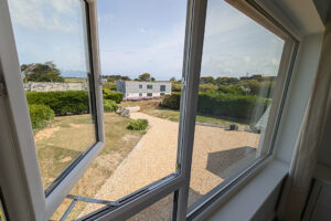View over parking area and front garden at Whitehaven