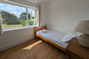 First floor twin room with window to the rear garden at Whitehaven