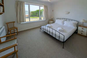 Ground floor king room at Whitehaven with window to front garden