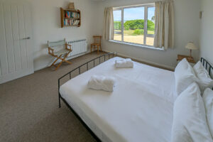 Ground floor king bedroom with window to the front garden at Whitehaven