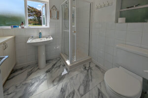 Ground floor bathroom at Whitehaven with shower cubicle toilet and wash hand basin