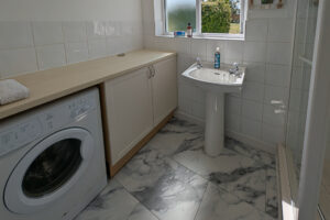 Ground floor bathroom at Whitehaven with shower, toilet, wash hand basin and laundry facilities