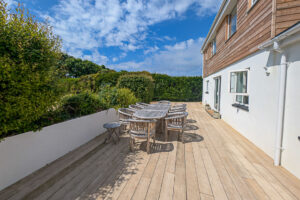 Outdoor decking area with outdoor dining furniture at Whitehaven