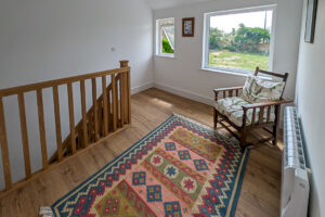 First floor landing at Whitehaven with window overlooking rear garden