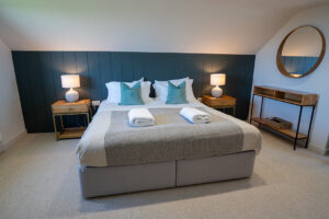 Frist floor ensuite bedroom 1 at Iona featuring a superking bed
