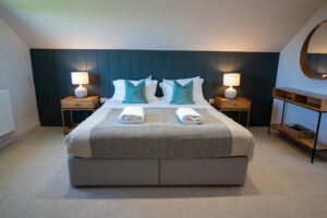 First floor ensuite bedroom 1 at Iona featuring a superking bed