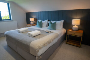 First floor ensuite bedroom 1 at Iona featuring a superking bed