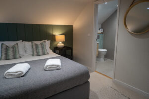 Ensuite to bedroom 3 at Iona featuring a king bed