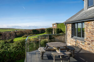 The outside terrace at Iona looking over some fields